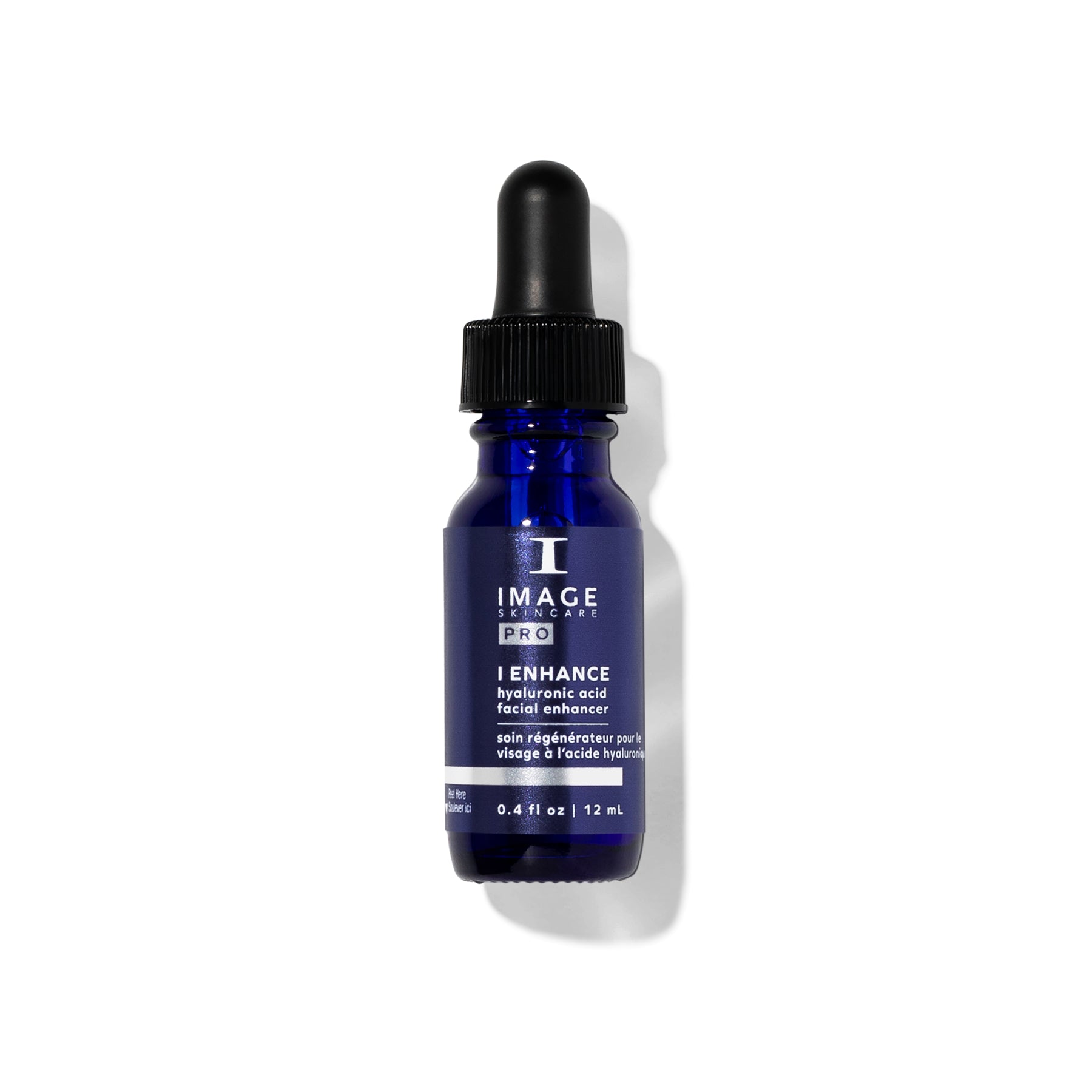 Blue skincare serum bottle with black cap on a white background