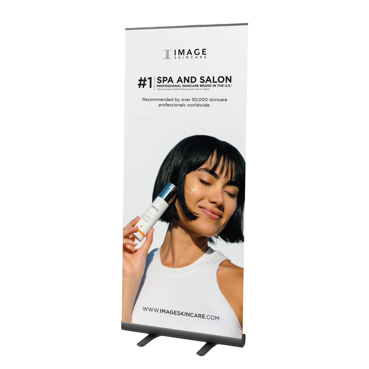 A promotional floor banner for IMAGE SKINCARE, featuring a woman applying skincare product with text detailing spa and salon recommendations.