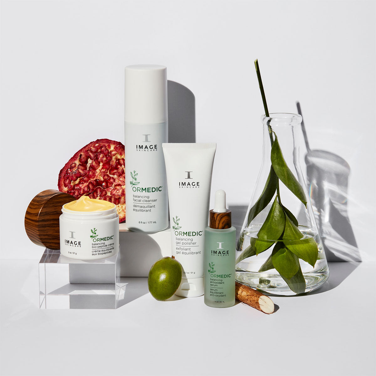 Collection of skincare products with natural elements on a light background