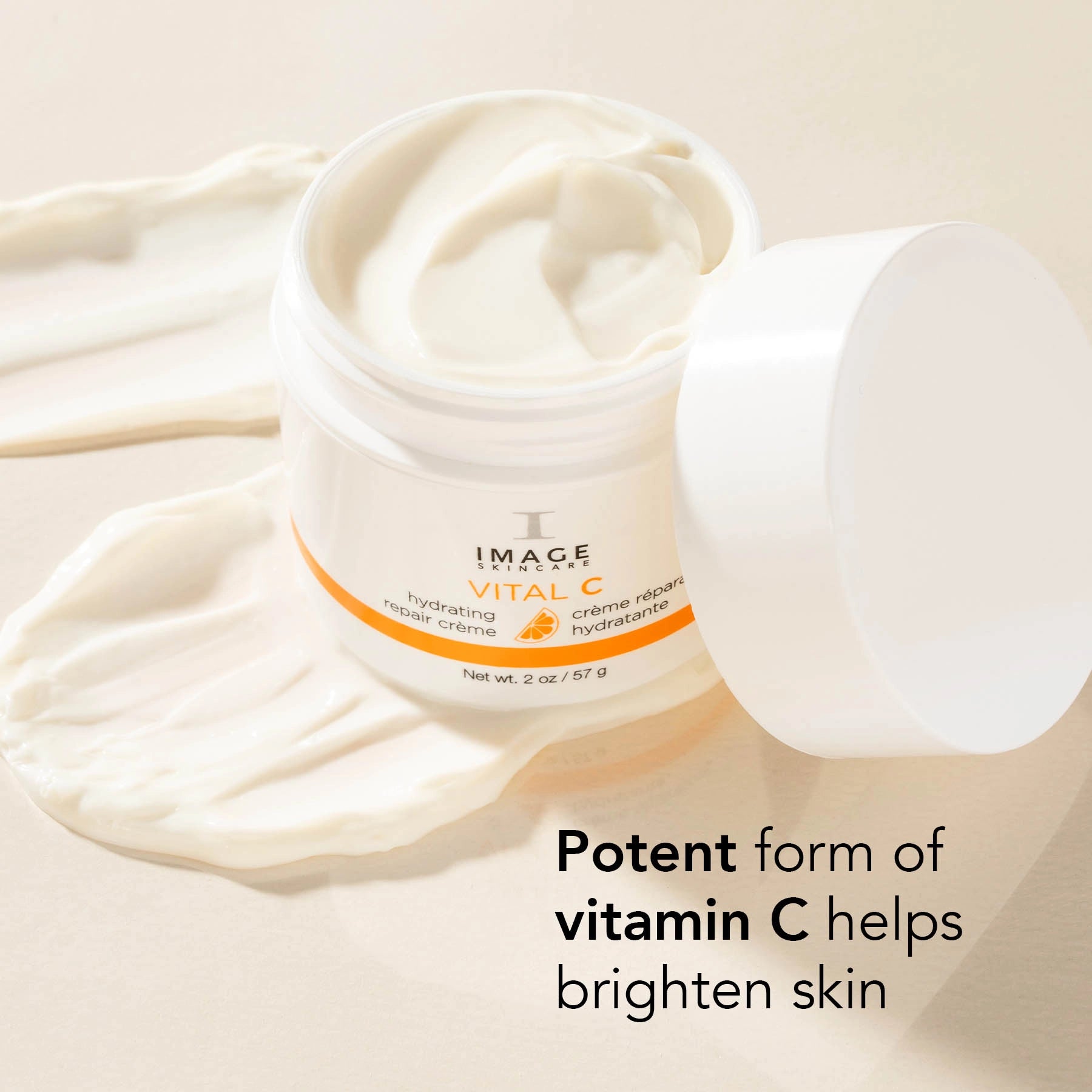 Jar of skincare cream with text highlighting vitamin C benefits on a beige background