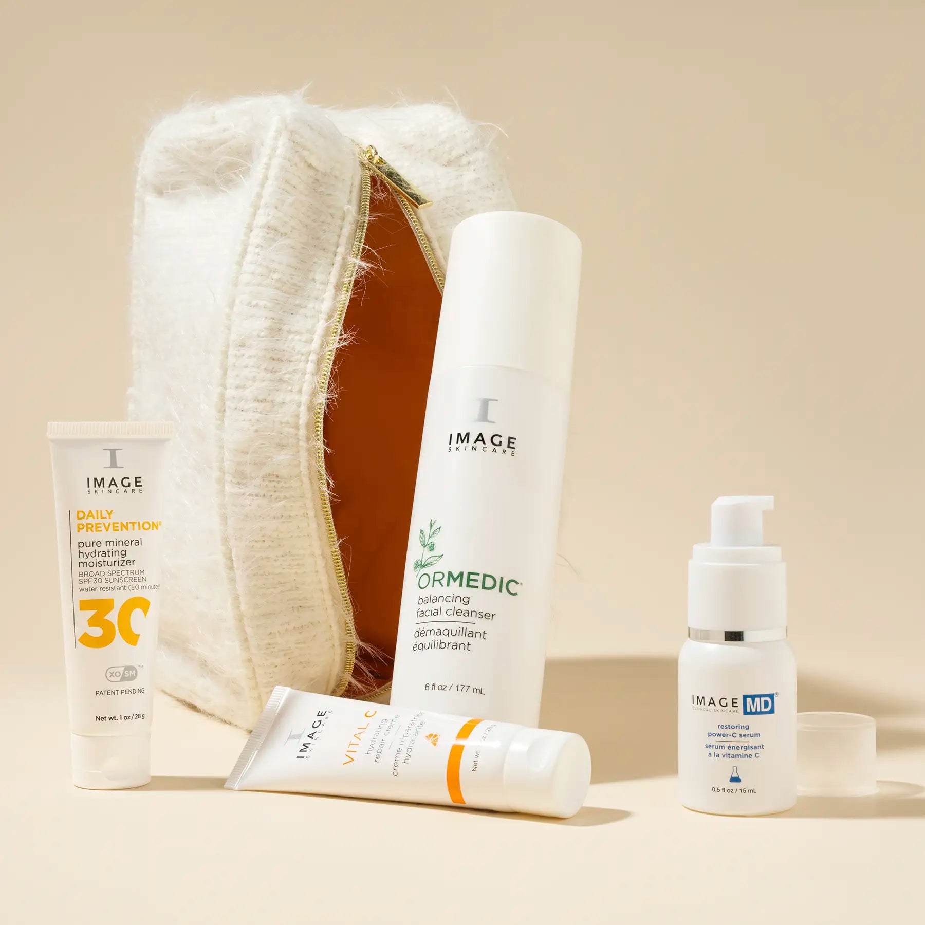 bag unzipped and propped up vertically with products displayed in front 