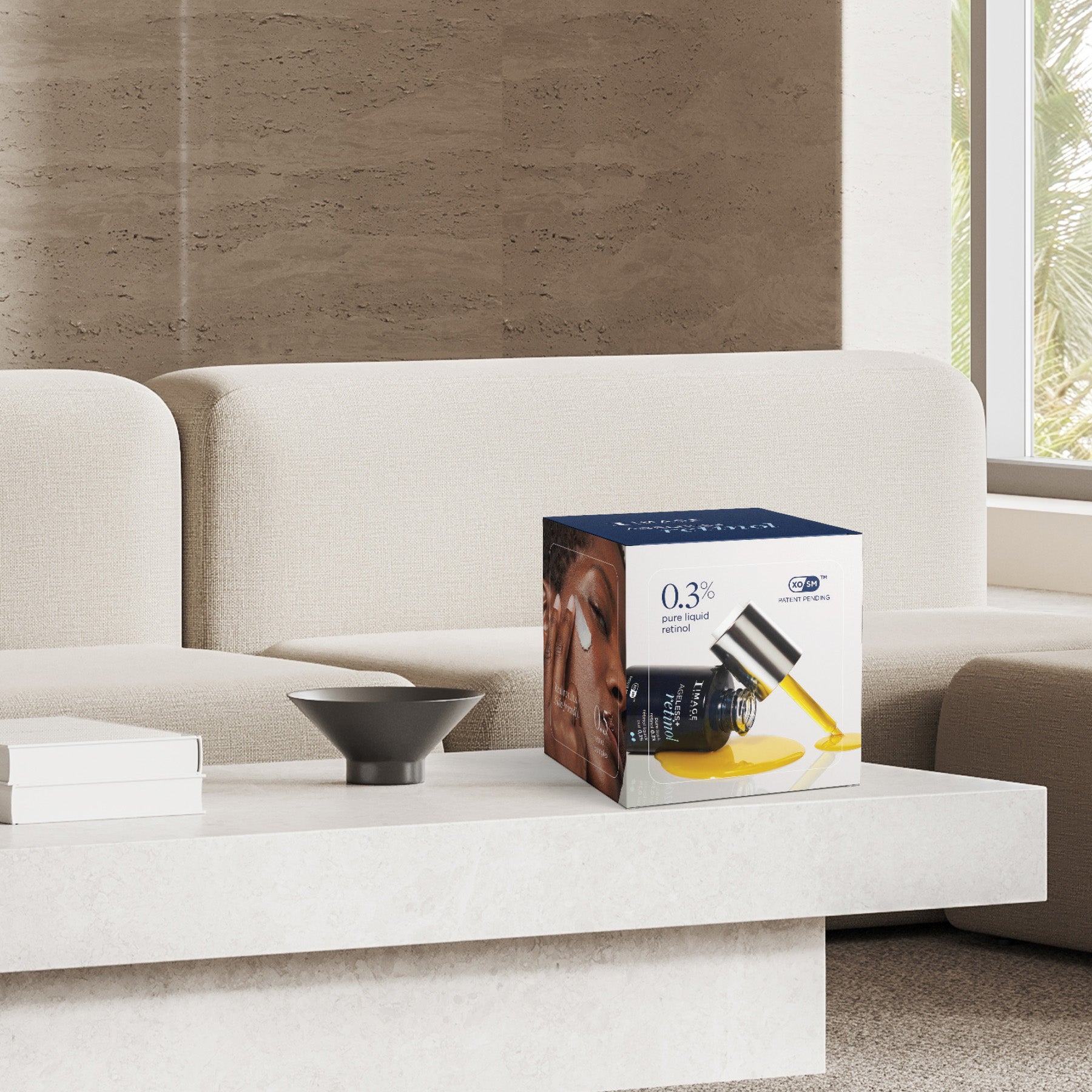 A box of AGELESS+ retinol skincare product displayed on a modern white coffee table in a bright living room setting.