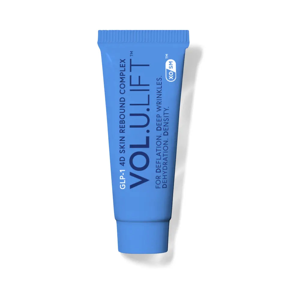Blue skincare tube labeled 'VOL.U.LIFT' on a white background