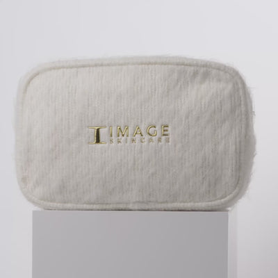 video of white bag and products spinning on block